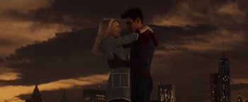 Movie still from “The Amazing Spider-Man 2” (2014), directed by Marc Webb – A man and a woman hugging in front of a city skyline at night; Medium shot, Low angle