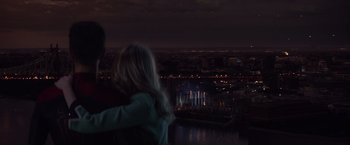 Movie still from “The Amazing Spider-Man 2” (2014), directed by Marc Webb – A man and a woman looking out over a city at night; Medium shot, Over the shoulder angle