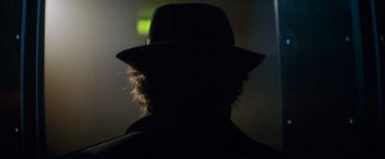 Movie still from “The Amazing Spider-Man 2” (2014), directed by Marc Webb – A man wearing a hat in the dark; Close Up shot, Low angle