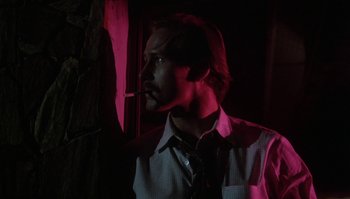 Movie still from “Body Heat” (1981), directed by Lawrence Kasdan – A man smoking a cigarette while wearing a shirt and tie; Close Up shot, Low angle