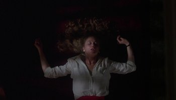 Movie still from “Body Heat” (1981), directed by Lawrence Kasdan – A woman with her hair flying in the air; Medium shot, Overhead angle