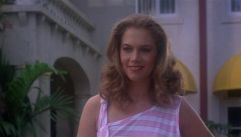 Movie still from “Body Heat” (1981), directed by Lawrence Kasdan – A woman in a pink and white striped shirt; Close Up shot, Low angle