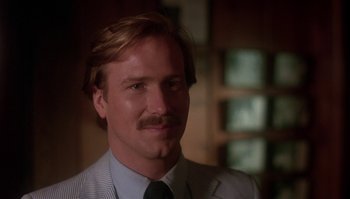 Movie still from “Body Heat” (1981), directed by Lawrence Kasdan – A person wearing a suit and tie; Close Up shot, Low angle