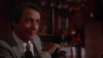 Movie still from “Body Heat” (1981), directed by Lawrence Kasdan – A person wearing a suit and tie; Close Up shot, Low angle