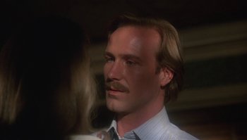 Movie still from “Body Heat” (1981), directed by Lawrence Kasdan – A person with a mustache; Close Up shot, Over the shoulder angle
