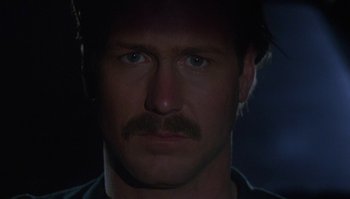 Movie still from “Body Heat” (1981), directed by Lawrence Kasdan – A person with a mustache; Close Up shot, Low angle