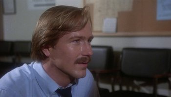 Movie still from “Body Heat” (1981), directed by Lawrence Kasdan – A person wearing a suit and tie; Close Up shot, Low angle