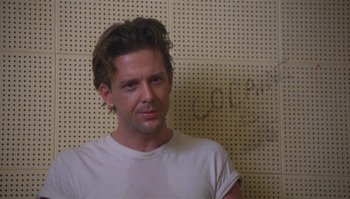 A person wearing a white t - shirt