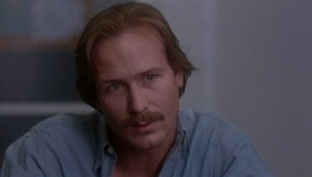 Movie still from “Body Heat” (1981), directed by Lawrence Kasdan – A person with a mustache; Close Up shot, Over the shoulder angle