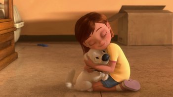 Movie still from “Bolt” (2008), directed by Chris Williams – A little girl sitting on the ground hugging a dog; Wide shot, Low angle