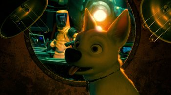 Movie still from “Bolt” (2008), directed by Chris Williams – A dog looking in a mirror with a person in the background; Medium shot, High angle