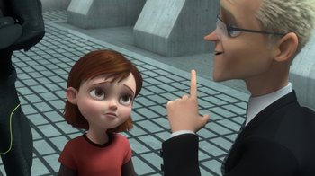 Movie still from “Bolt” (2008), directed by Chris Williams – An animated woman talking to a man in a black suit; Close Up shot, Over the shoulder angle