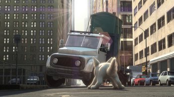 Movie still from “Bolt” (2008), directed by Chris Williams – A white dog standing in front of a large truck; Wide shot, Low angle