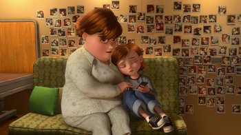 Movie still from “Bolt” (2008), directed by Chris Williams – An animated picture of a boy and a woman; Wide shot, High angle