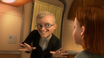 Movie still from “Bolt” (2008), directed by Chris Williams – A man in a suit and tie looking in the mirror; Medium shot, Over the shoulder angle