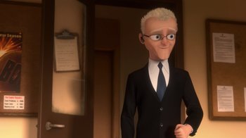 Movie still from “Bolt” (2008), directed by Chris Williams – A man in a suit and tie standing next to a door; Medium shot, Over the shoulder angle