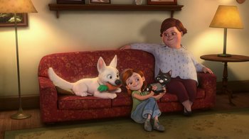 Movie still from “Bolt” (2008), directed by Chris Williams – A woman sitting on a couch next to a dog and a cat; Wide shot, High angle