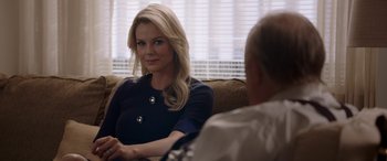 Movie still from “Bombshell” (2019), directed by Jay Roach – A woman sitting in front of a man on a couch; Close Up shot, Over the shoulder angle