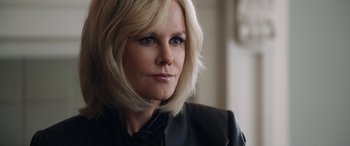 Movie still from “Bombshell” (2019), directed by Jay Roach – A person with blonde hair; Close Up shot, Over the shoulder angle