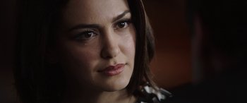 Movie still from “Bombshell” (2019), directed by Jay Roach – A woman's face in a dark room; Close Up shot, Over the shoulder angle