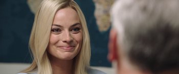 Movie still from “Bombshell” (2019), directed by Jay Roach – A person with long blonde hair; Close Up shot, Over the shoulder angle