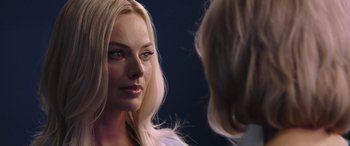 Movie still from “Bombshell” (2019), directed by Jay Roach – A woman with long blonde hair looking into a mirror; Close Up shot, Over the shoulder angle