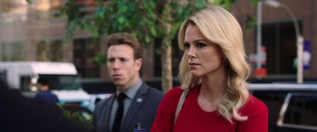 Movie still from “Bombshell” (2019), directed by Jay Roach – A man and a woman standing next to each other; Close Up shot, Over the shoulder angle