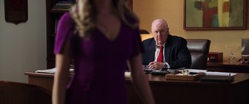 Movie still from “Bombshell” (2019), directed by Jay Roach – An older man sitting in front of a young woman; Medium shot, Over the shoulder angle