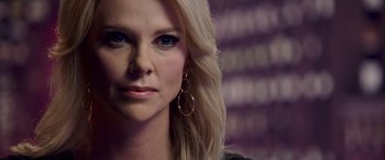 Movie still from “Bombshell” (2019), directed by Jay Roach – A person with long blonde hair; Close Up shot, Over the shoulder angle