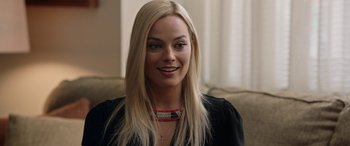 Movie still from “Bombshell” (2019), directed by Jay Roach – A person with long blonde hair; Close Up shot, Over the shoulder angle