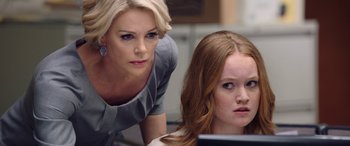 Movie still from “Bombshell” (2019), directed by Jay Roach – A woman standing next to a young girl looking at a computer screen; Close Up shot, Over the shoulder angle