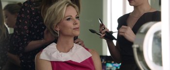 Movie still from “Bombshell” (2019), directed by Jay Roach – A woman getting her hair cut by a stylist; Close Up shot, Over the shoulder angle
