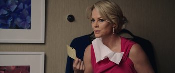 Movie still from “Bombshell” (2019), directed by Jay Roach – A woman holding a piece of paper in her hand; Close Up shot, Over the shoulder angle