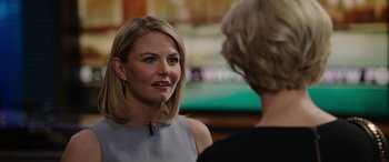 Movie still from “Bombshell” (2019), directed by Jay Roach – Two women talking to each other in front of a television; Close Up shot, Over the shoulder angle