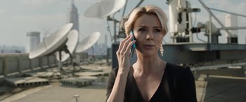 Movie still from “Bombshell” (2019), directed by Jay Roach – A woman is talking on a cell phone outside; Close Up shot, Low angle