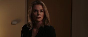 Movie still from “Bombshell” (2019), directed by Jay Roach – A woman with blonde hair is looking at the camera; Close Up shot, Over the shoulder angle