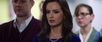 Movie still from “Bombshell” (2019), directed by Jay Roach – A person with long hair; Close Up shot, Over the shoulder angle