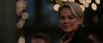 Movie still from “Bombshell” (2019), directed by Jay Roach – A person wearing a jacket; Close Up shot, Over the shoulder angle