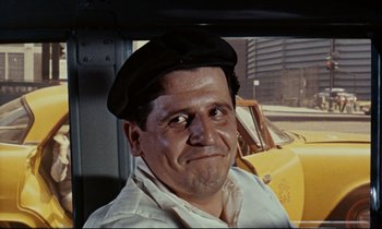 Movie still from “Bon Voyage!” (1962), directed by James Neilson – A person wearing a hat in a car; Close Up shot, Low angle