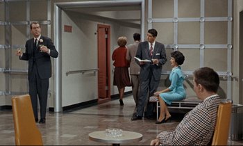 A group of people standing in a room
