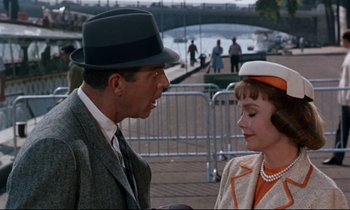 Movie still from “Bon Voyage!” (1962), directed by James Neilson – A man and a woman talking to each other; Medium shot, Over the shoulder angle