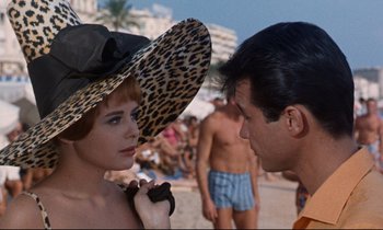 Movie still from “Bon Voyage!” (1962), directed by James Neilson – A man and a woman on the beach; Close Up shot, Over the shoulder angle
