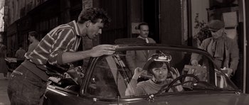 Movie still from “Bonjour Tristesse” (1958), directed by Otto Preminger – A man and a woman in the back seat of a car; Medium shot, Low angle