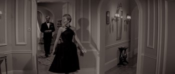 Movie still from “Bonjour Tristesse” (1958), directed by Otto Preminger – A black and white photo of a woman in a black dress; Wide shot, Low angle