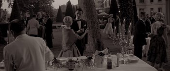 Movie still from “Bonjour Tristesse” (1958), directed by Otto Preminger – A man and a woman standing in front of a tree; Medium shot, Over the shoulder angle