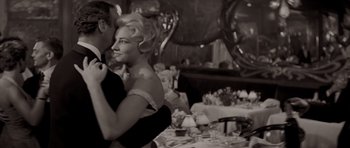 Movie still from “Bonjour Tristesse” (1958), directed by Otto Preminger – A man and a woman dancing at a party; Medium shot, Low angle