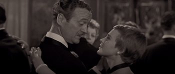 Movie still from “Bonjour Tristesse” (1958), directed by Otto Preminger – An older man and a young woman in formal wear; Close Up shot, Over the shoulder angle