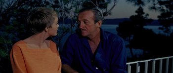 Movie still from “Bonjour Tristesse” (1958), directed by Otto Preminger – An older man sitting next to a young boy; Close Up shot, Over the shoulder angle