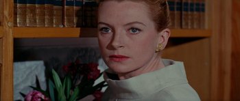 Movie still from “Bonjour Tristesse” (1958), directed by Otto Preminger – A person wearing a white shirt; Close Up shot, Low angle