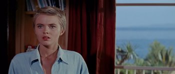 Movie still from “Bonjour Tristesse” (1958), directed by Otto Preminger – A woman with short blonde hair standing in front of a window; Close Up shot, Low angle